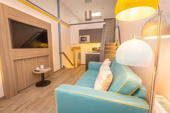 Studio, Courtyard Area (Split Level, 2nd bed by arrangement) | Living area | Flat-screen TV