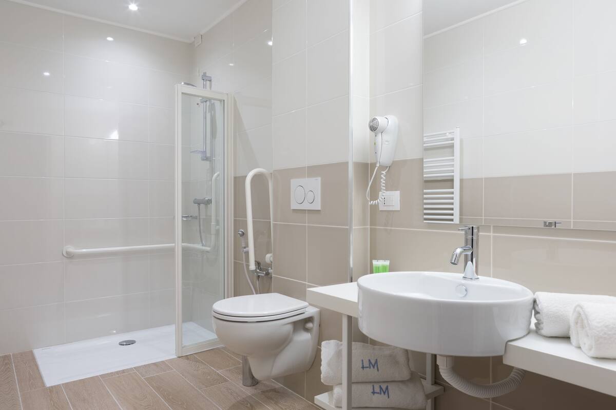 shower, designer toiletries, hair dryer, bathrobes