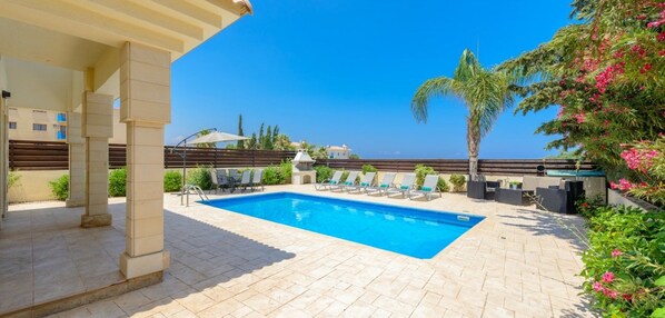 Seasonal outdoor pool, pool umbrellas, pool loungers