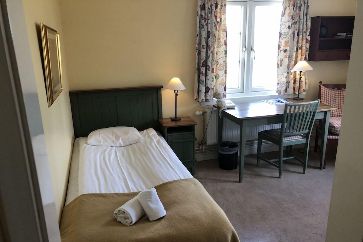 Desk, blackout curtains, iron/ironing board (on request)