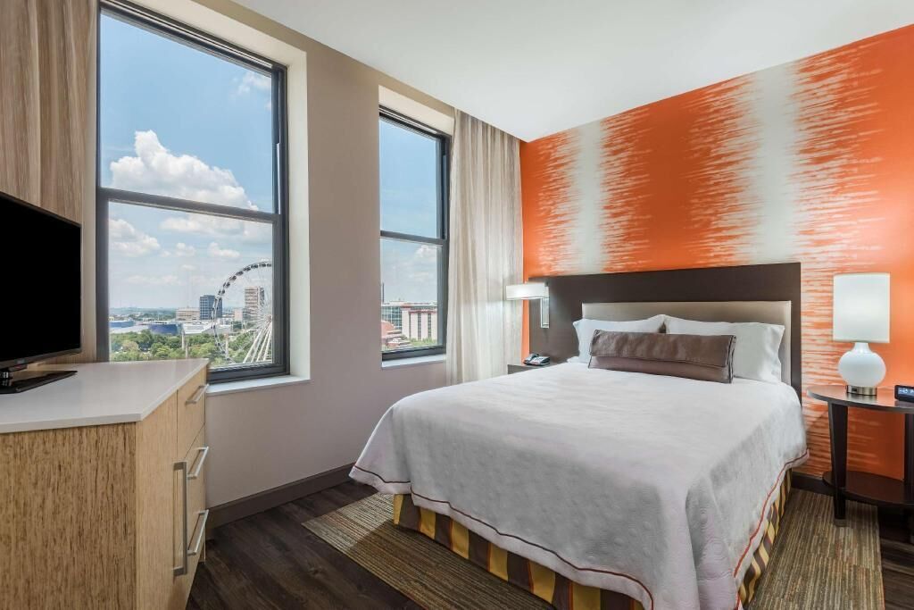 Premium bedding, desk, laptop workspace, iron/ironing board