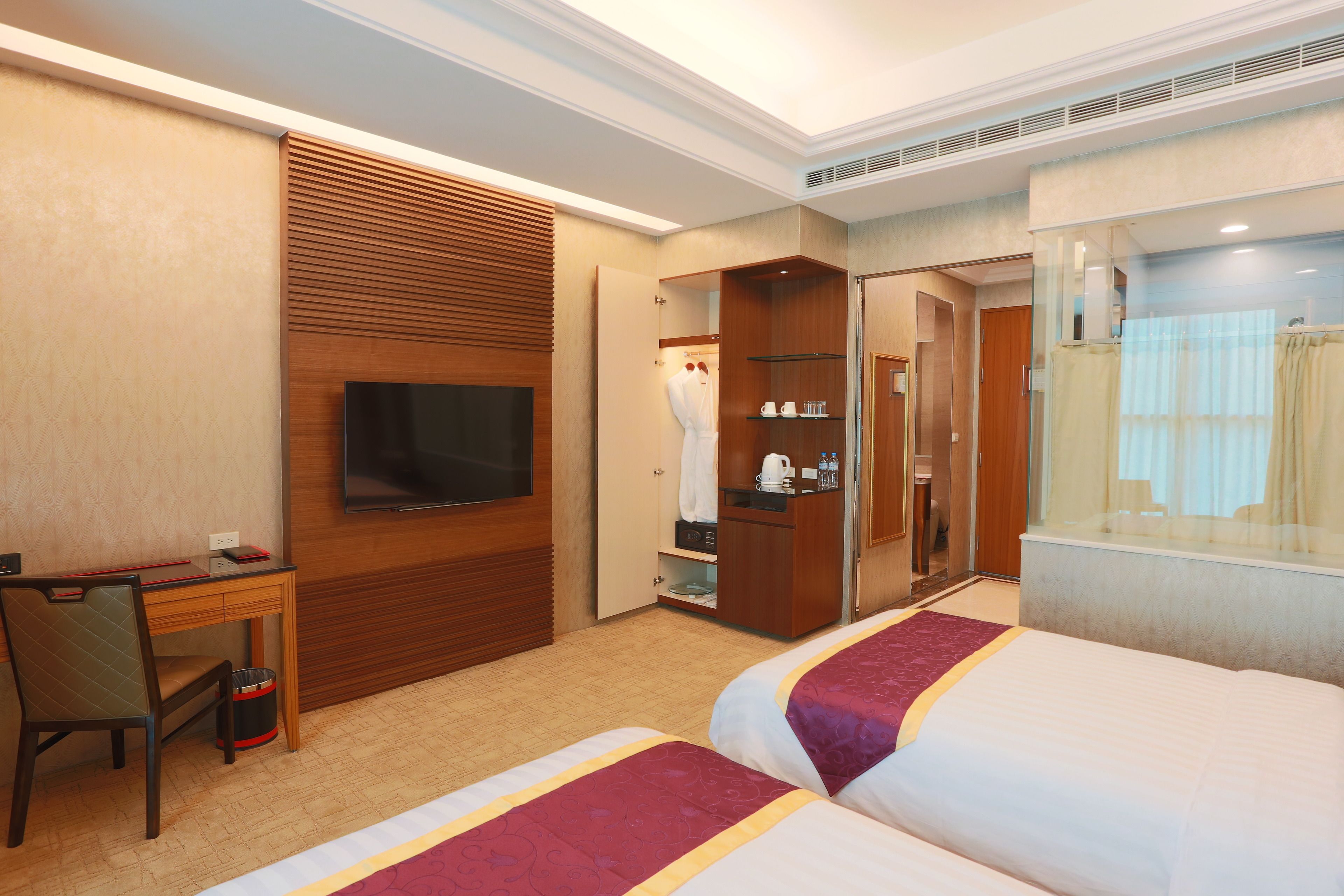 deluxe twin room | in-room safe, desk, blackout curtains, iron/ironing board