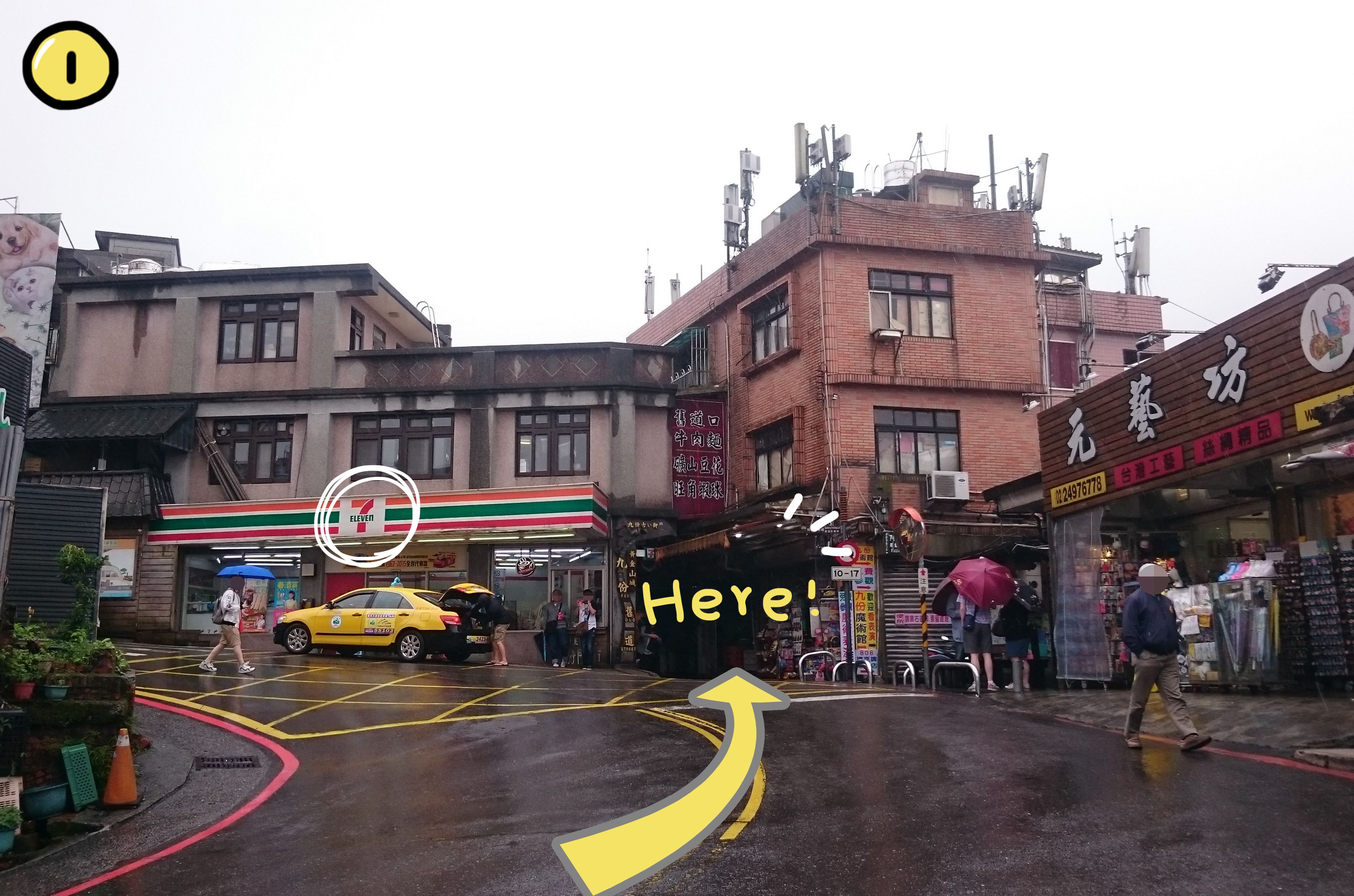 A street scene with a 7-Eleven store, a taxi, and a pedestrian crossing.