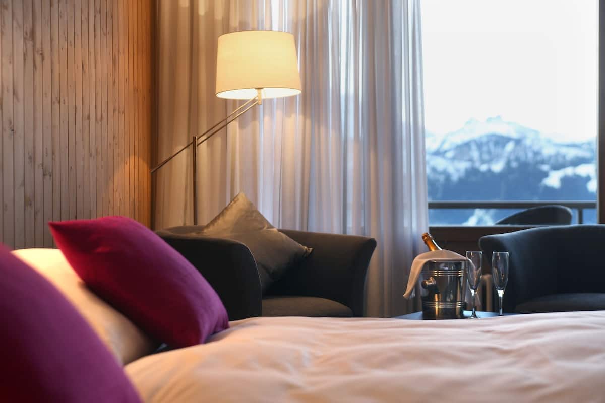 double room, balcony (lake & mountain view) | hypo-allergenic bedding, in-room safe, individually decorated