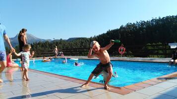 Relax by the pool surrounded by a forested hill and enjoy a refreshing swim.