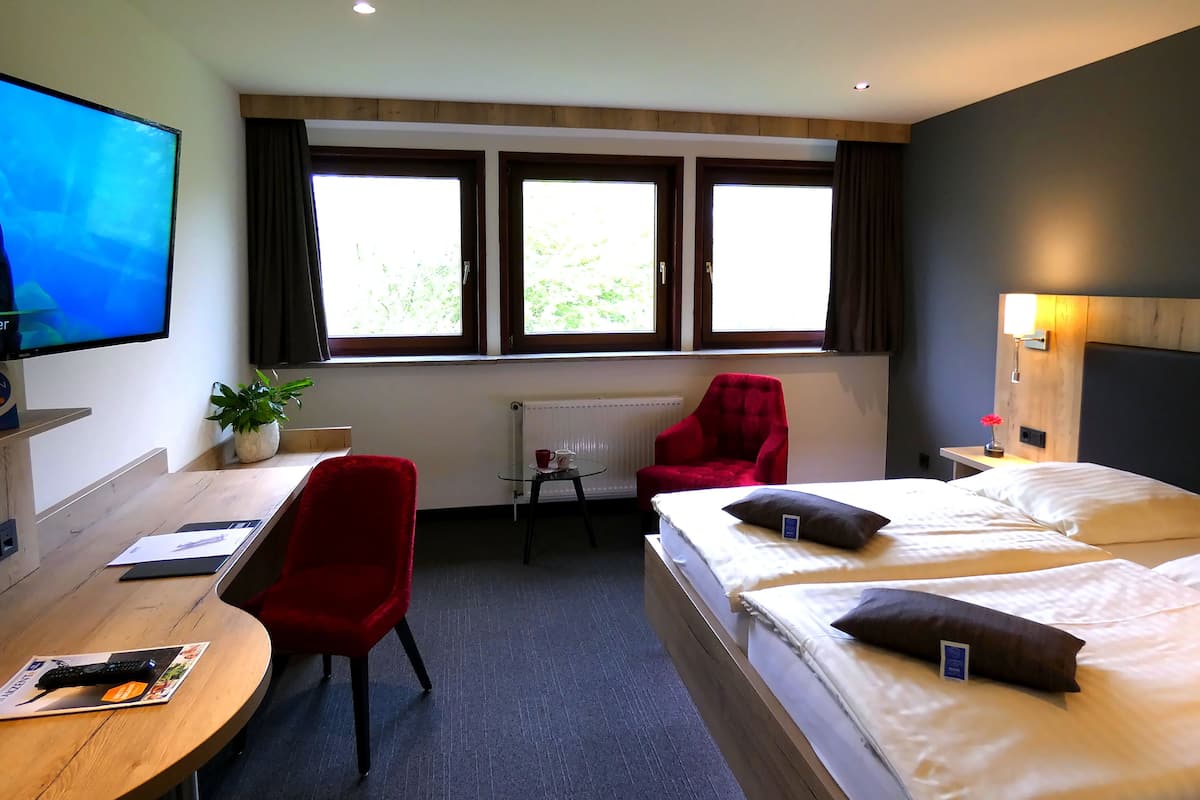 Hypo-allergenic bedding available, in-room safe, desk, laptop workspace