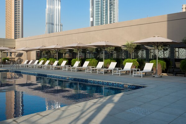 Outdoor pool, pool umbrellas, pool loungers