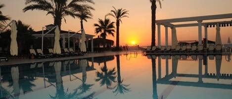 Indoor pool, outdoor pool, pool umbrellas, sun loungers