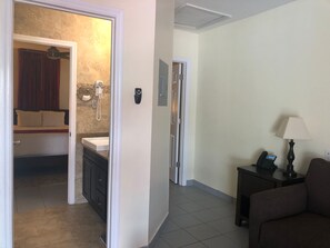 In-room safe, desk, laptop workspace, blackout drapes - The Lodgings Hotel SureStay Collection by Best Western (Providenciales)