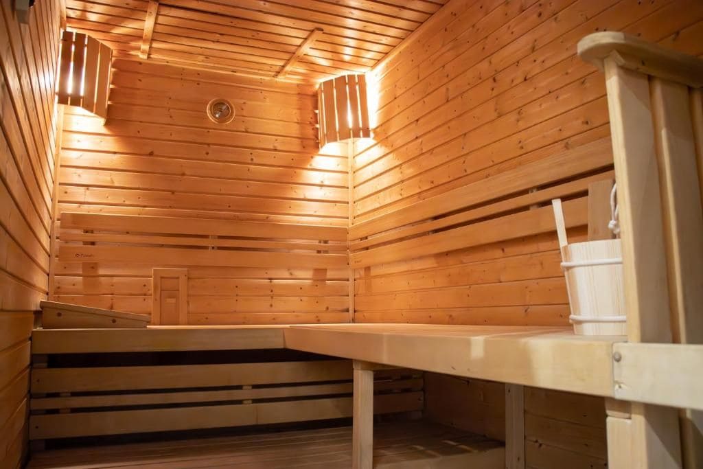 A sauna with wooden walls and benches.