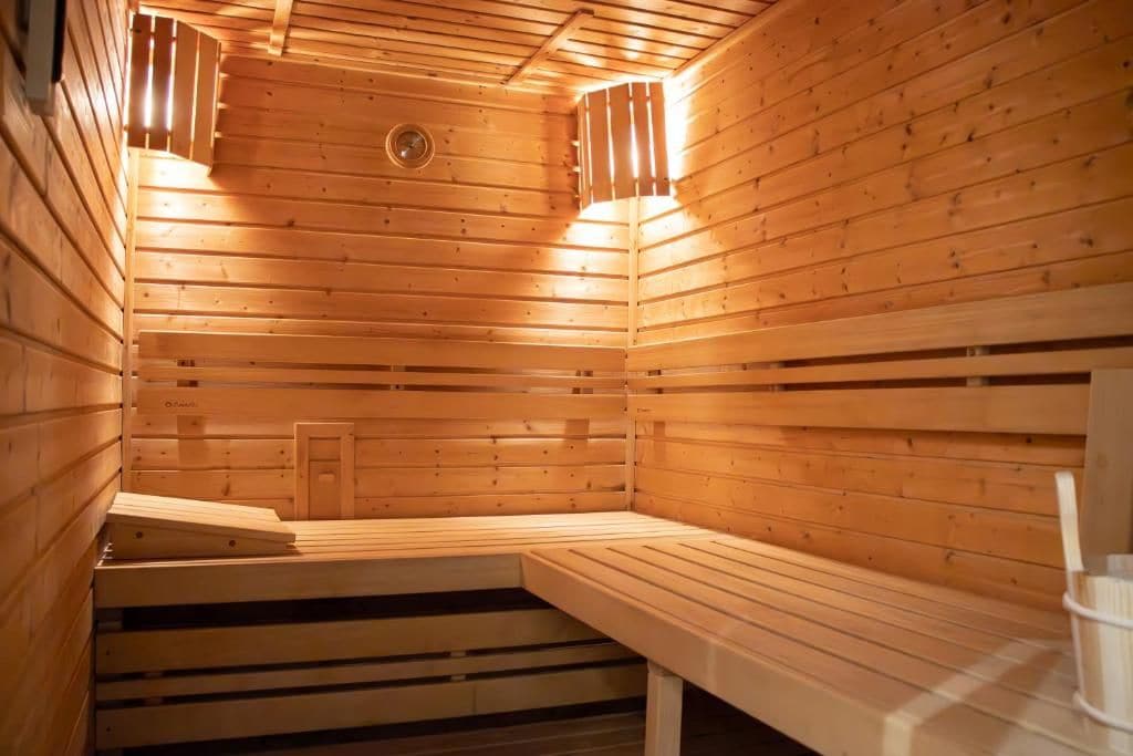 A sauna with wooden walls and benches.