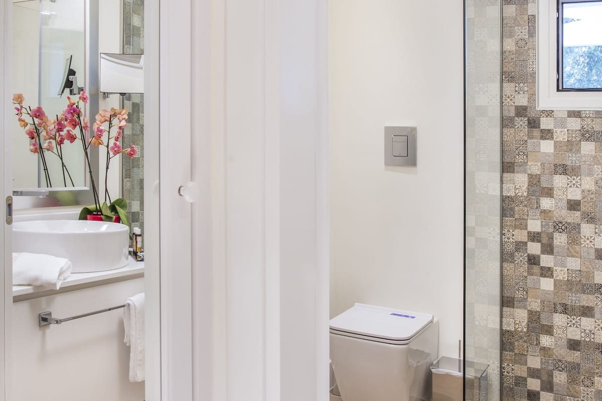 shower, rainfall showerhead, designer toiletries, hair dryer