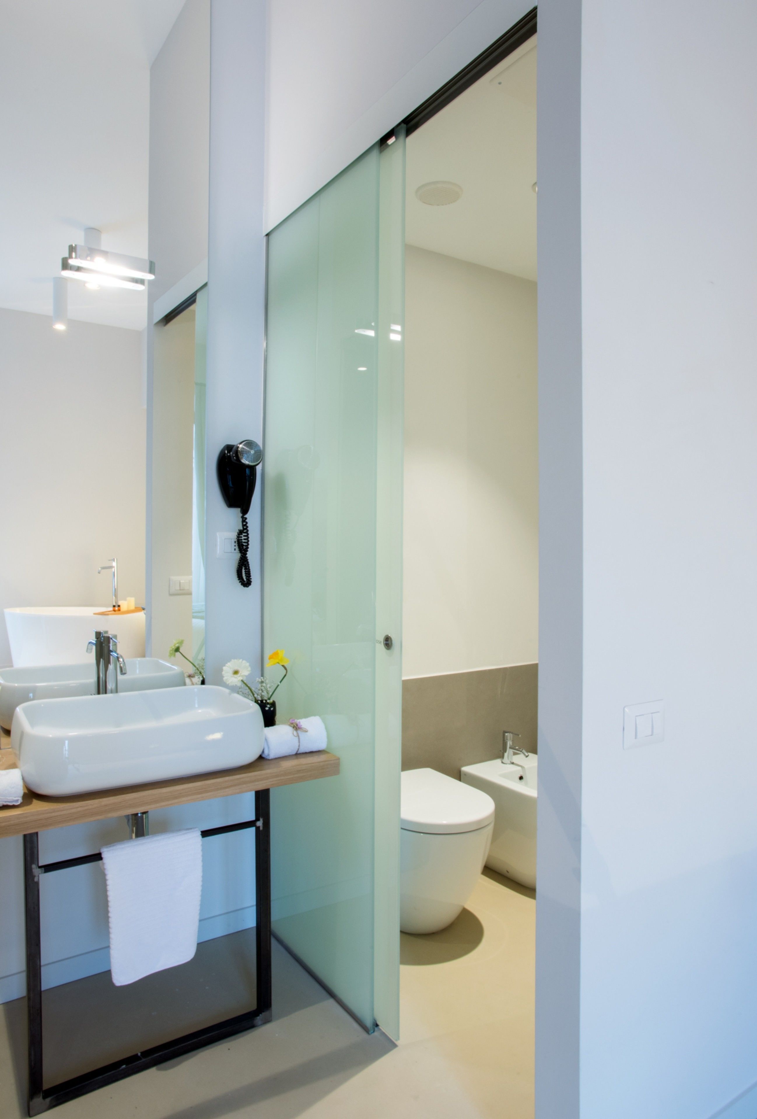 shower, hair dryer, bidet, towels