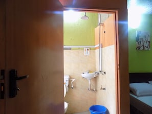 A bathroom with a toilet, sink, and shower. - Posh Apartments Self Catering (Lagos)