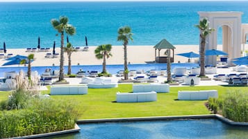 On the beach, sun loungers, beach umbrellas, beach towels