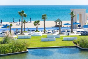 On the beach, sun loungers, beach umbrellas, beach towels