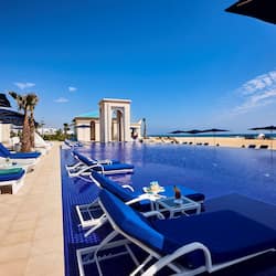 Indoor pool, outdoor pool, pool umbrellas, pool loungers