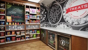 A snack display area with various packaged snacks and a chalkboard sign reading "Welcome to Waynesboro."