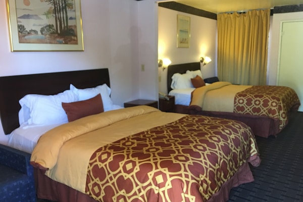 Room, 2 Queen Beds | Living area | Flat-screen TV