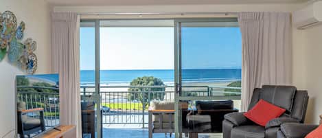 Deluxe Apartment, 1 Bedroom, Ocean View | Living area | 42-inch flat-screen TV with satellite channels, TV