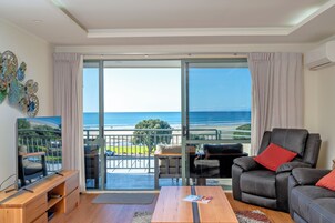 Deluxe Apartment, 1 Bedroom, Ocean View | Living area | 42-inch flat-screen TV with satellite channels, TV