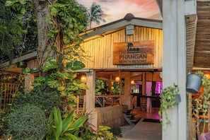 A wooden building with a sign reading 'PHANGAN BEACH RESORT.' - Phangan Beach Resort (Ko Pha-ngan)