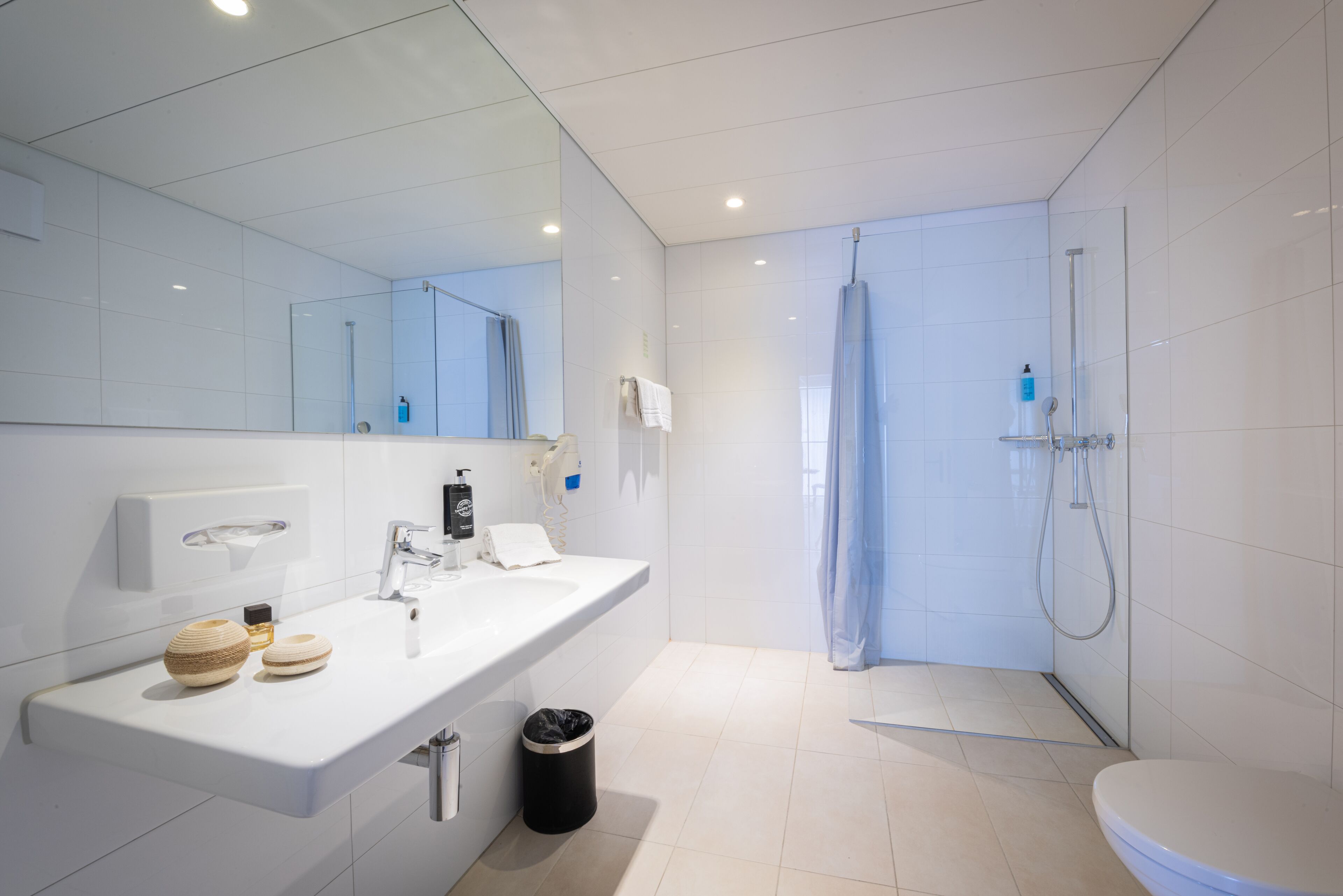 family room | bathroom | shower, hair dryer, heated floors, towels