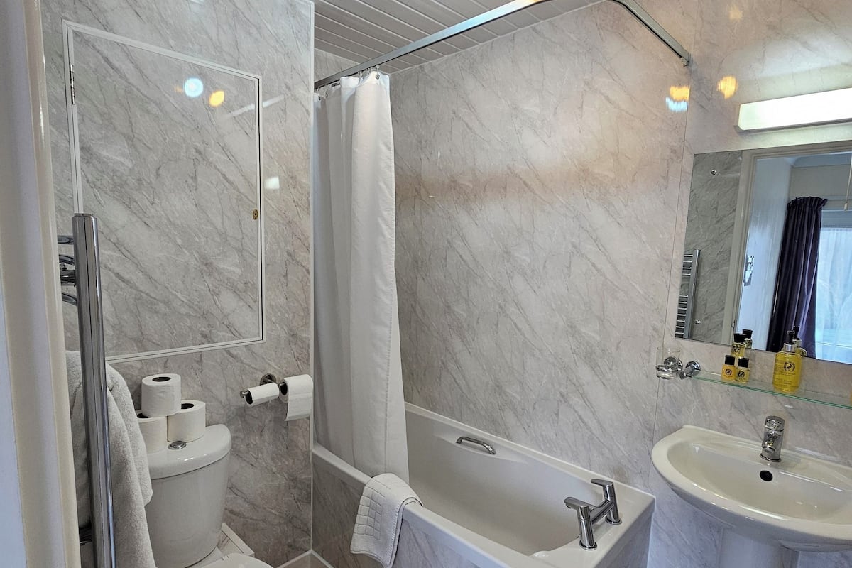 Hair dryer, towels, soap, shampoo