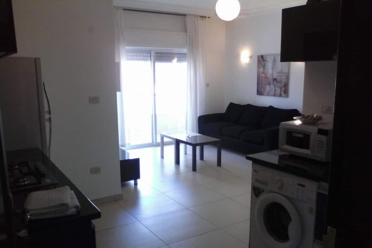 En-suite 2 bedroom apartment | Living area | Flat-screen TV