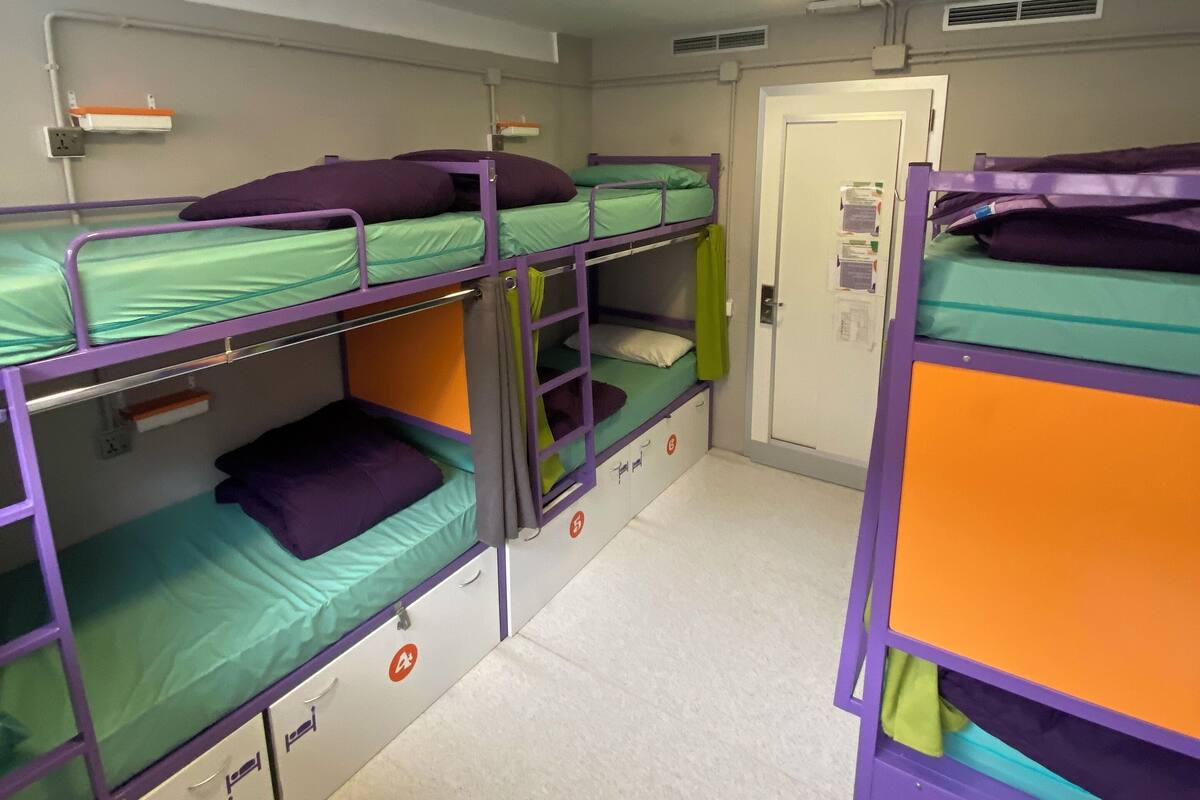 High bed in shared 6-bed mixed room with shared bathroom | Hypo-allergenic bedding available, blackout drapes, soundproofing