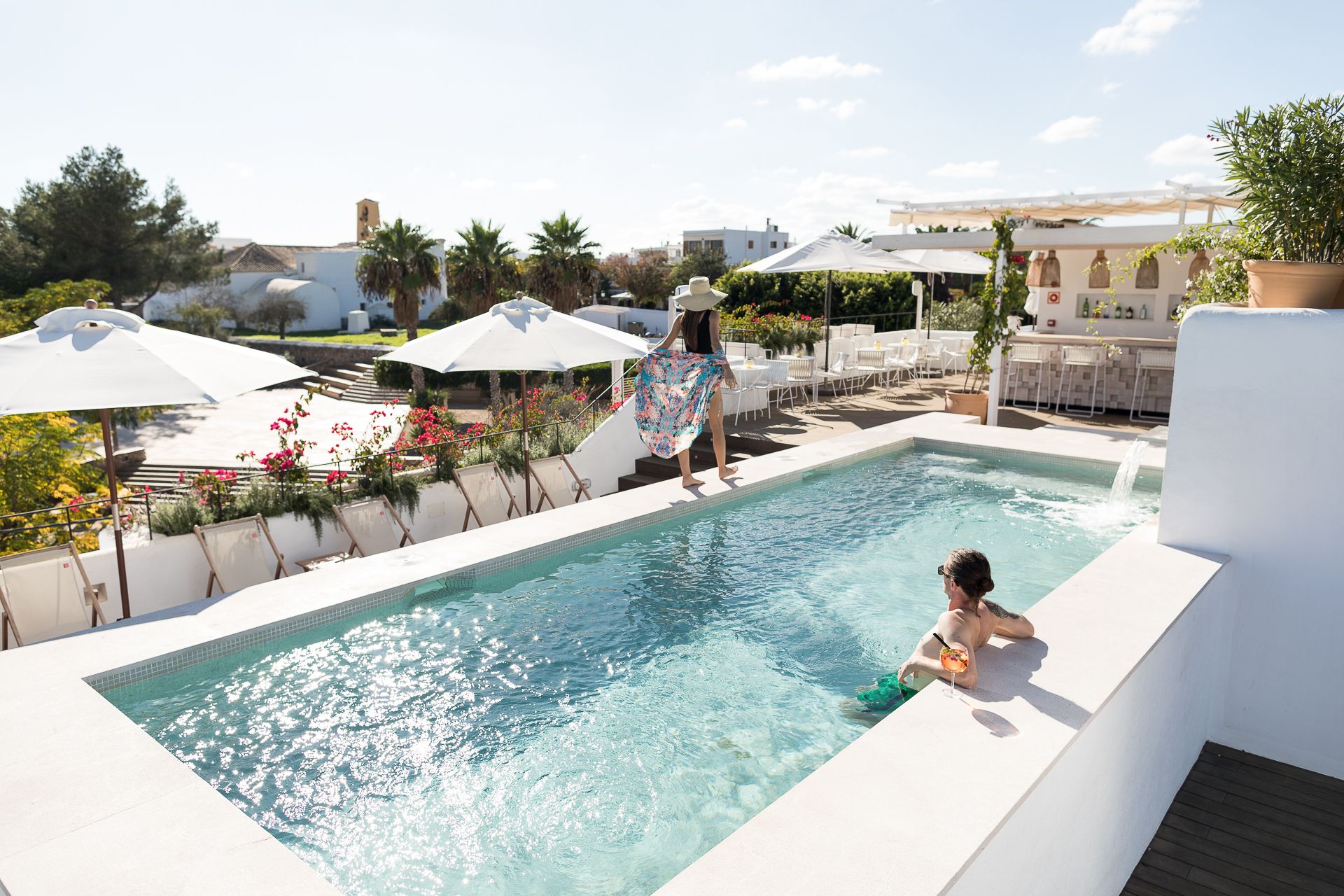 seasonal outdoor pool, pool umbrellas, pool loungers