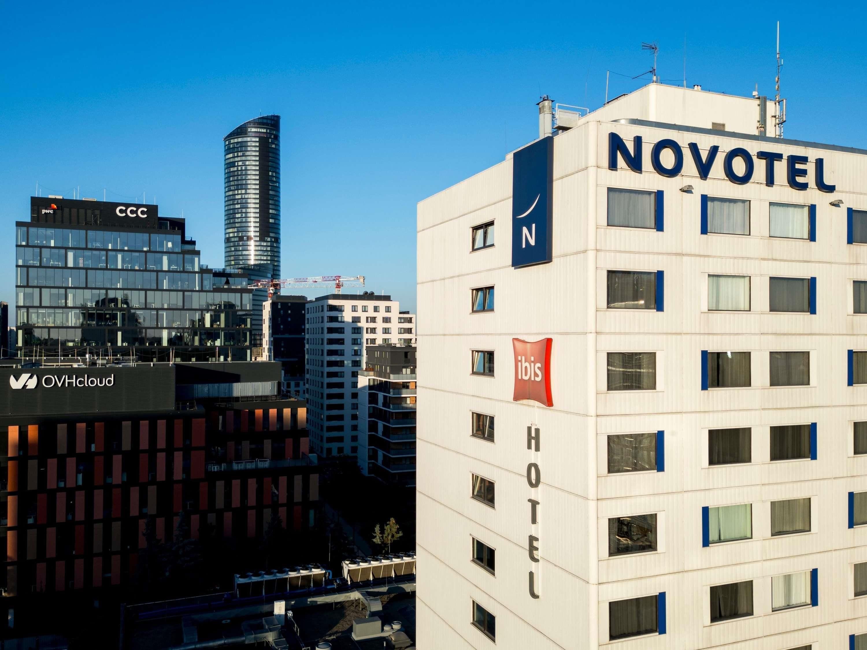 A Novotel hotel with a modern facade, multiple floors, and a prominent 'Novotel' sign.