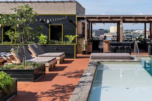 Outdoor pool, open 11:00 AM to 7:00 PM, pool loungers