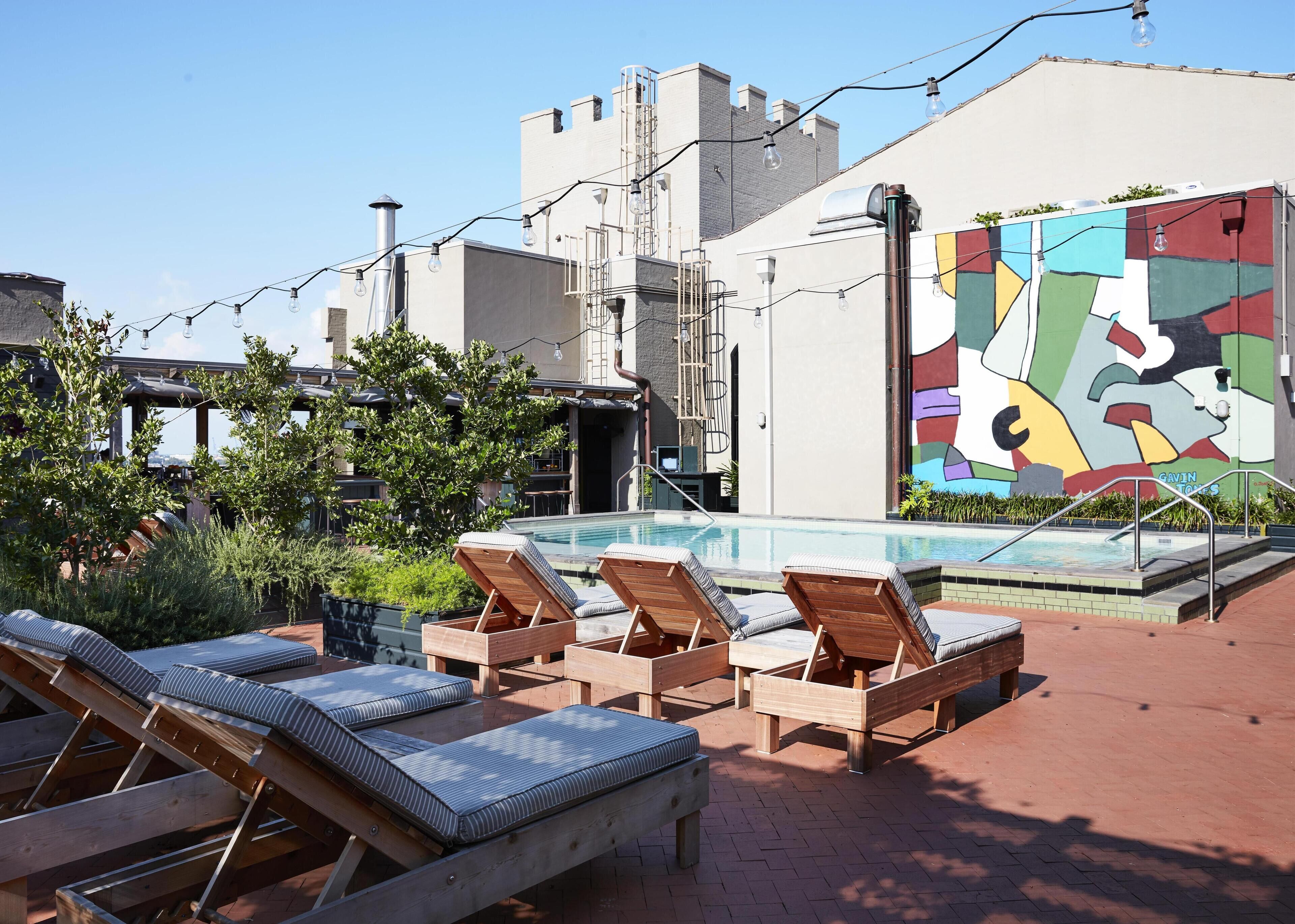 Outdoor pool, open 11:00 AM to 7:00 PM, pool loungers