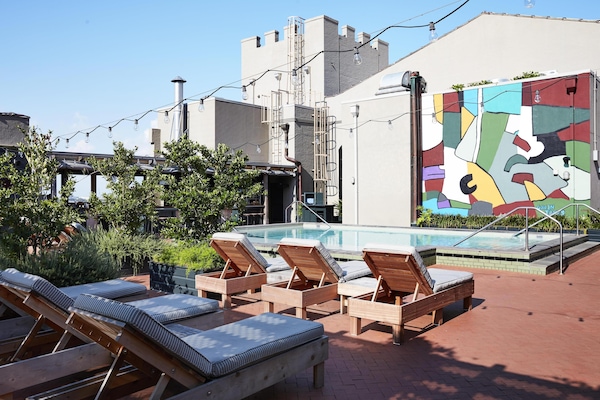 Outdoor pool, open 11:00 AM to 7:00 PM, pool loungers