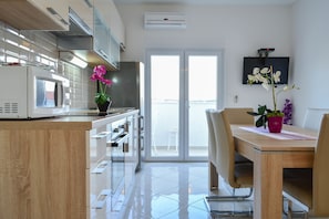 Luxury Apartment, 2 Bedrooms, Sea View | Private kitchen | Fridge, microwave, stovetop, dishwasher