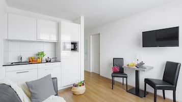 Suite, 1 Bedroom | Living area | TV