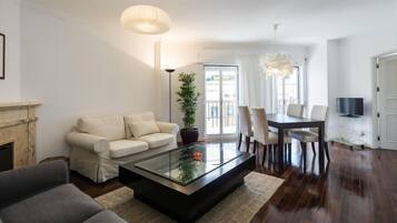 Premium Apartment, 2 Bedrooms, Balcony | Living room | TV
