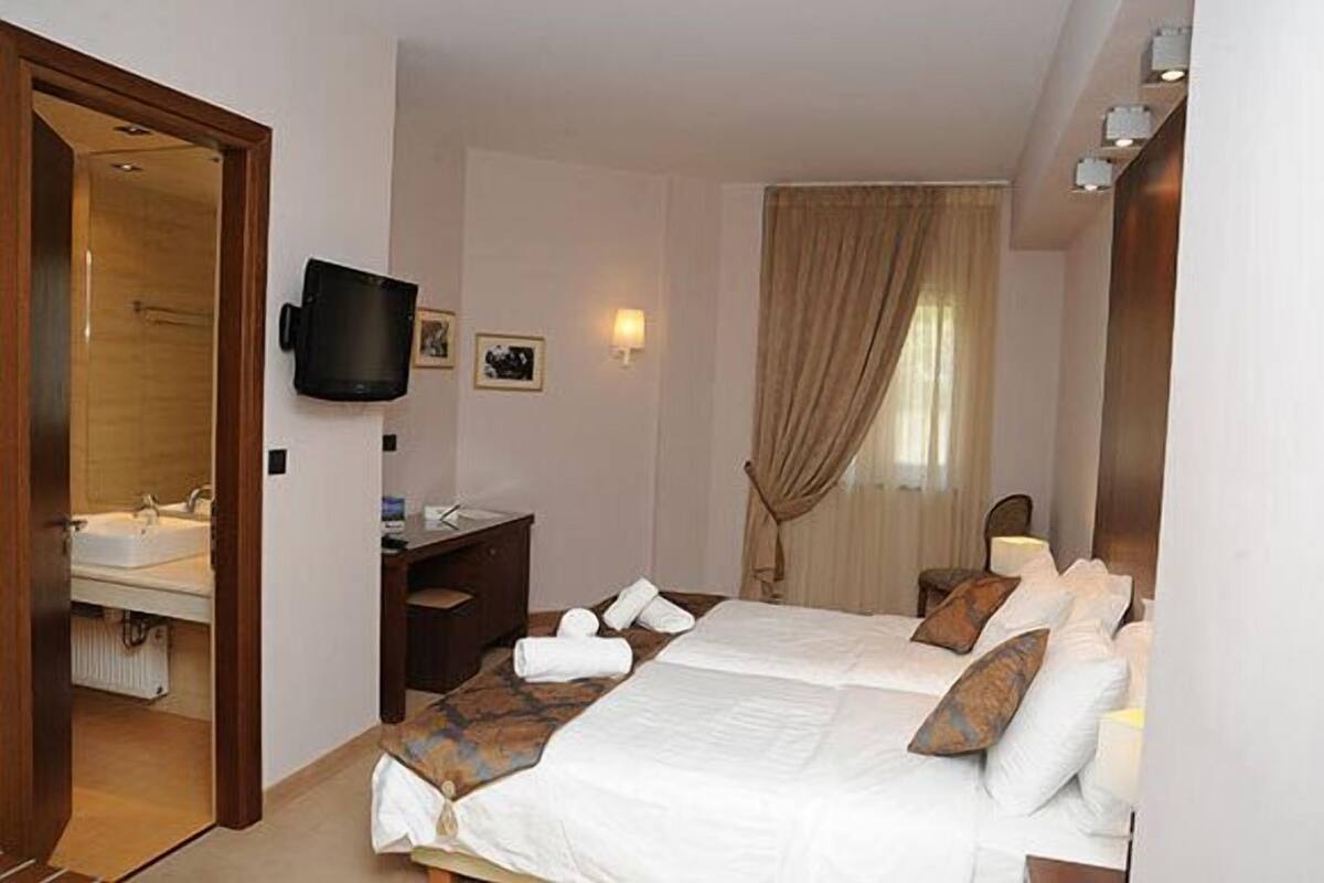 Habitación estándar con 2 camas individuales, vista al jardín | Sábanas de algodón egipcio y ropa de cama de alta calidad 