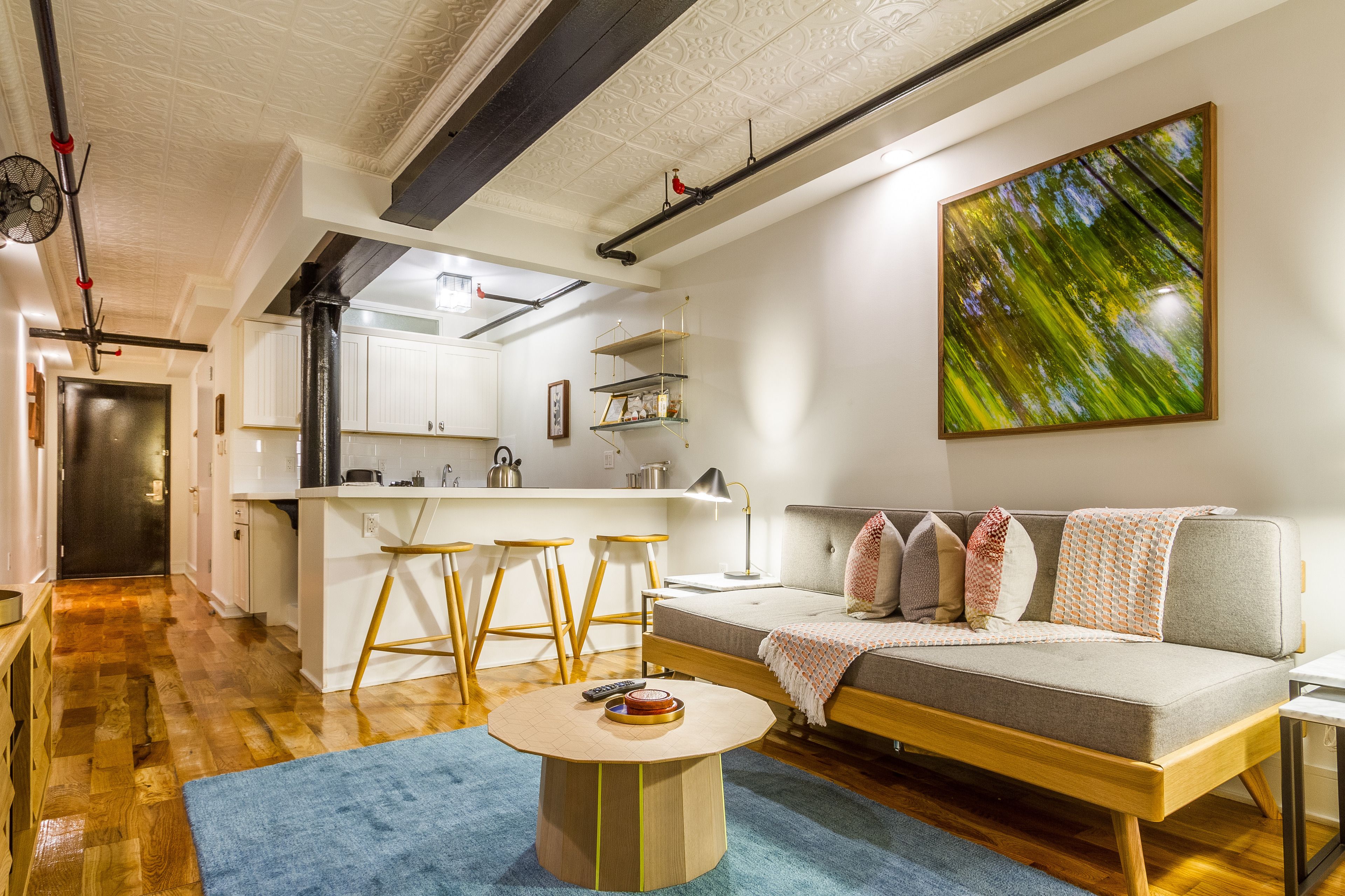 deluxe loft suite with patio (lower level) | living area | 43-inch flat-screen tv with cable channels, tv, ipod dock