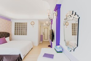 A bedroom with a bed, a bedside table, a mirror, and a door leading to another room. - Welcome The Sun Enjoy The Moon (Kaohsiung)