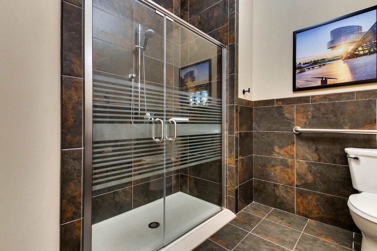 suite, 1 king bed with sofa bed, accessible (2 rooms, hearing, roll in shower) | bathroom | combined shower/bathtub, free toiletries, hair dryer, towels