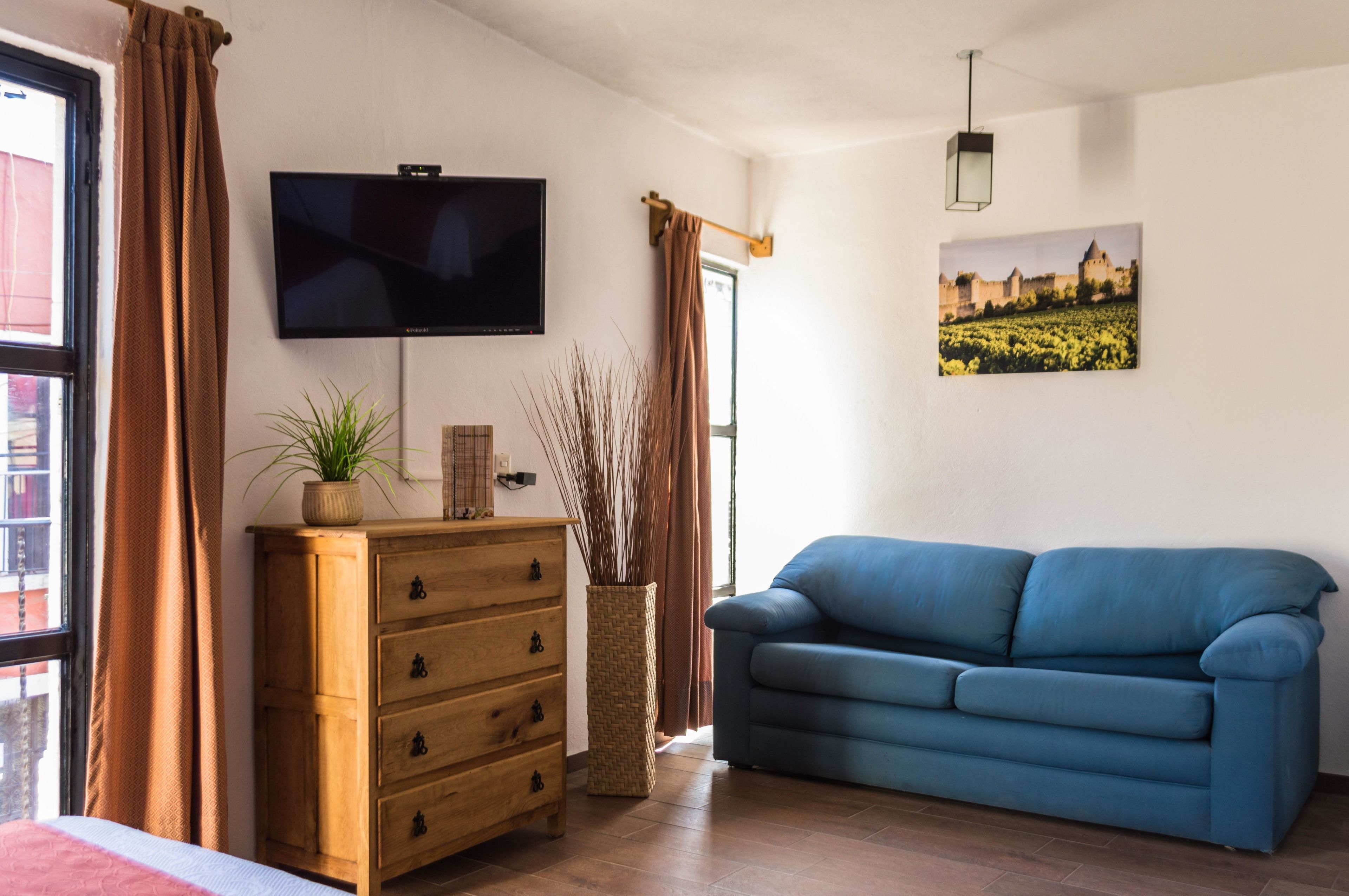 Quarto casal | Área de estar | TV de tela plana