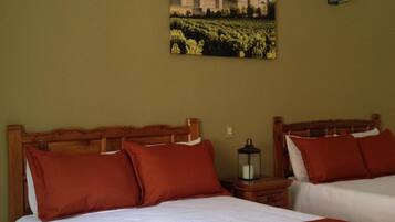 Desk, iron/ironing board, bed sheets