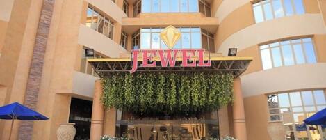 A multi-story building with a prominent 'JEWEL' sign above the entrance.