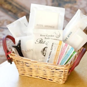 A wicker basket containing various bath products including body sponge, herbal extra, moisture milk, cleansing foam, and a lady bath. - Central Hotel Takasaki (Takasaki)