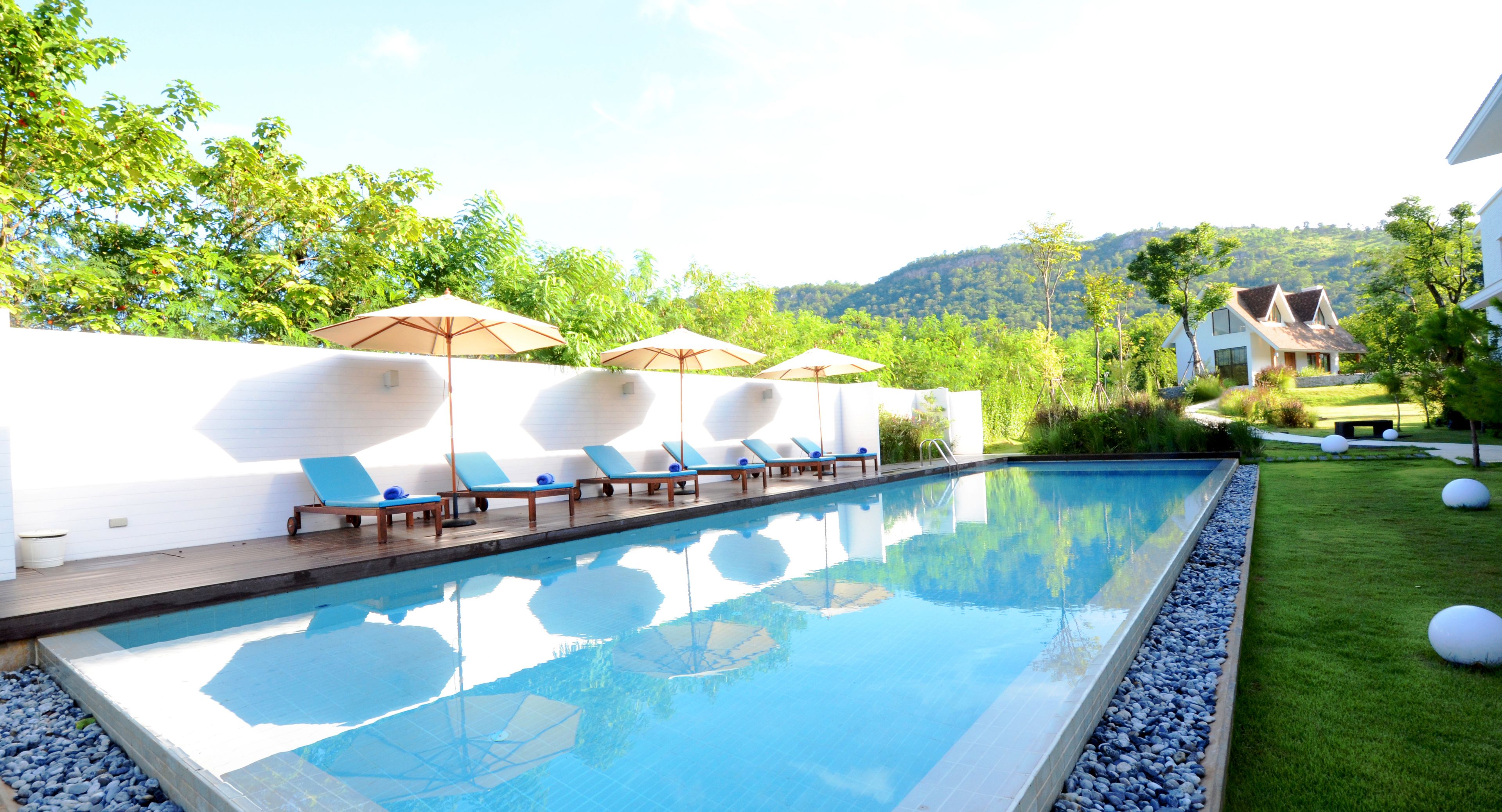 outdoor pool, pool umbrellas, pool loungers