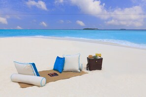 On the beach, white sand, sun loungers, scuba diving