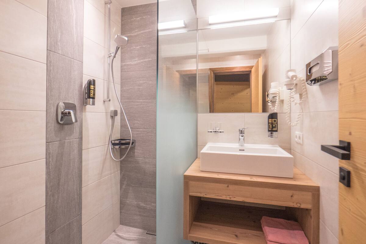 comfort room, balcony (typ c) | bathroom | shower, hair dryer, towels, soap