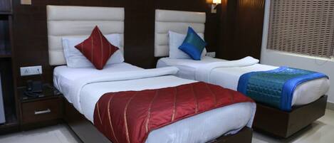 Premium bedding, desk, iron/ironing board, rollaway beds